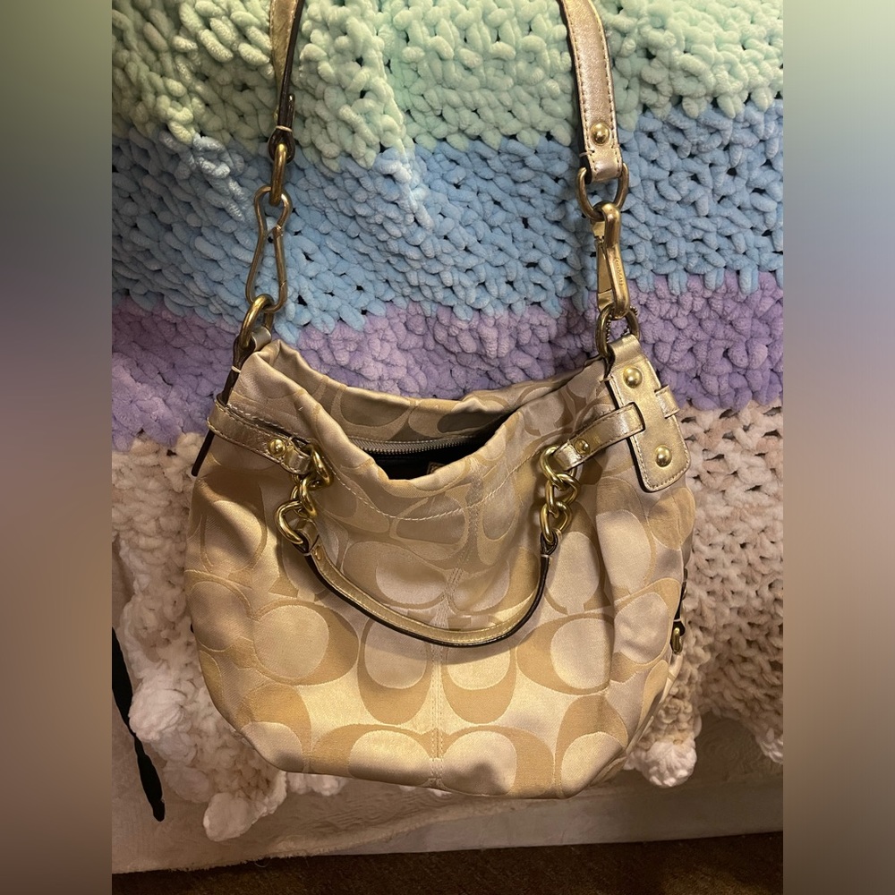 Super cute gold Coach purse silky material